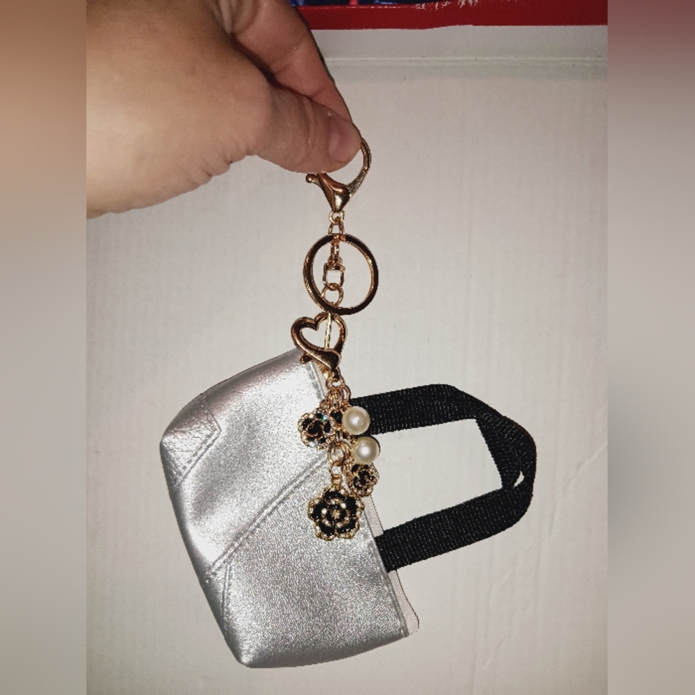 Silver min bag with charm
